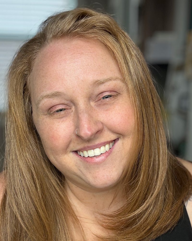 Jen Shannon smiling in her studio