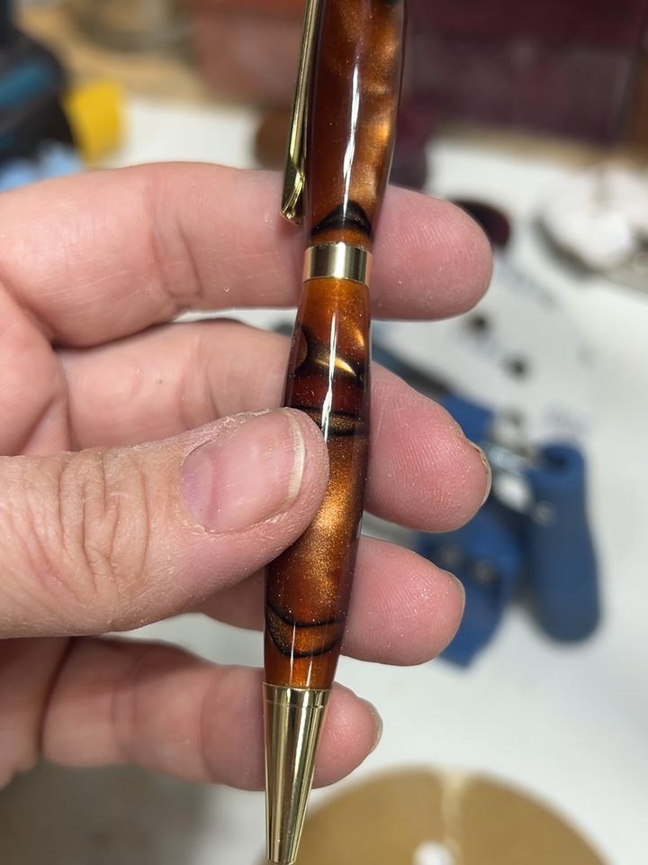Pen with copper and black resin and gold hardware