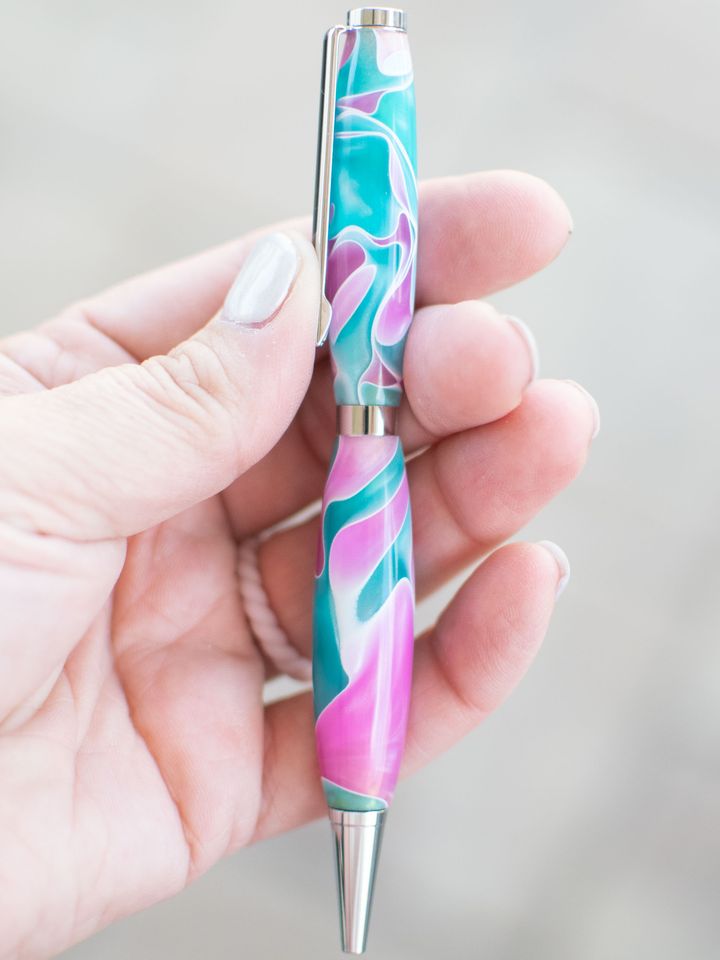 Pen with swirled pink, teal, and white resin and silver hardware